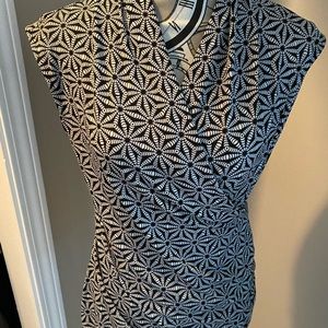 Black and white sleeveless top.